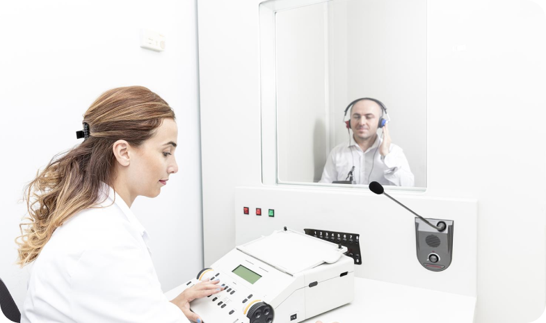 Beltone technician with a patient during a hearing exam