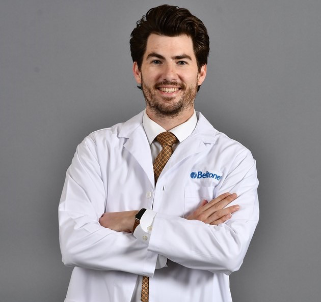 Beltone hearing aid technician in a lab coat