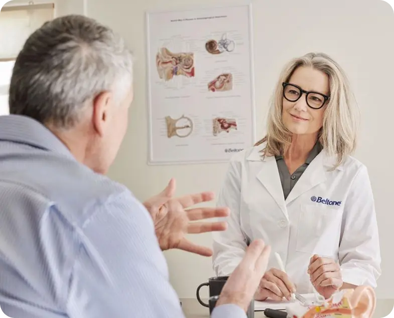 Man and woman discussing hearing aids
