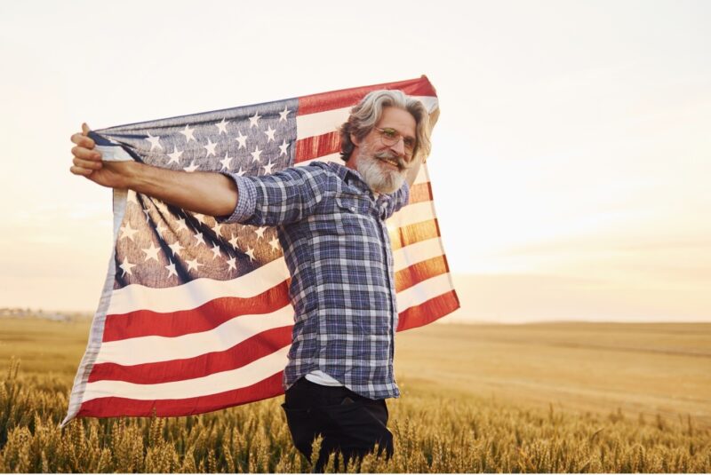 Man carrying the flag of United States of America