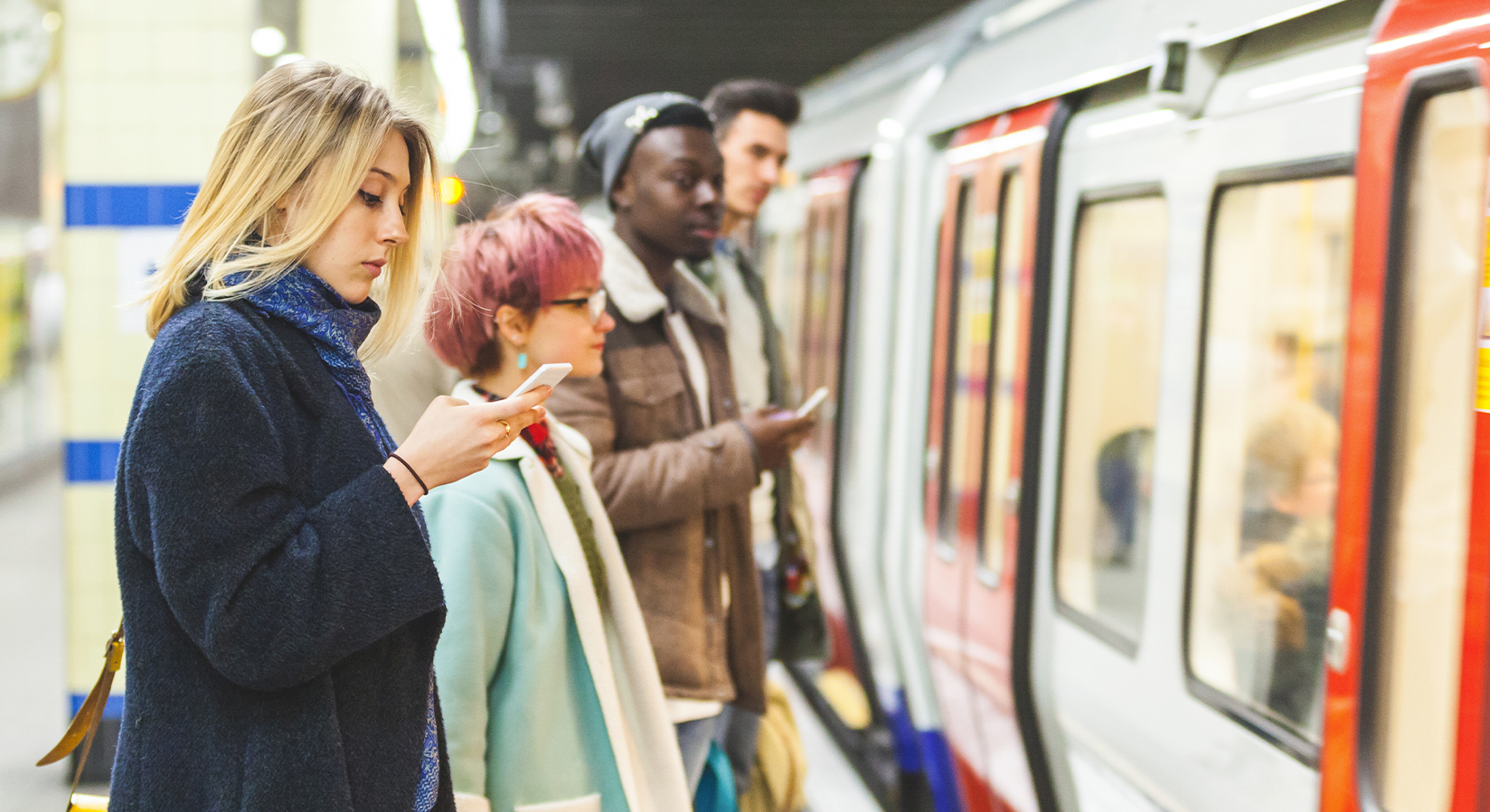 people at train station waiting for train